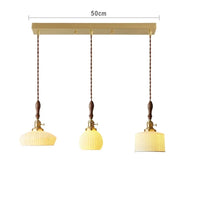 Suspension  design en céramique associant prise en cuivre et bois