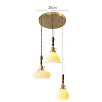 Suspension  design en céramique associant prise en cuivre et bois