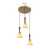 Suspension  design en céramique associant prise en cuivre et bois