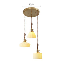 Suspension  design en céramique associant prise en cuivre et bois