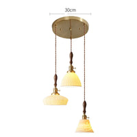 Suspension  design en céramique associant prise en cuivre et bois