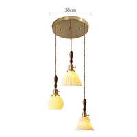 Suspension  design en céramique associant prise en cuivre et bois