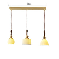 Suspension  design en céramique associant prise en cuivre et bois
