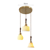 Suspension  design en céramique associant prise en cuivre et bois