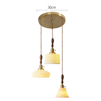 Suspension  design en céramique associant prise en cuivre et bois