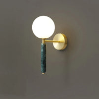 Applique murale en marbre avec boule de verre pour une décoration lumineuse