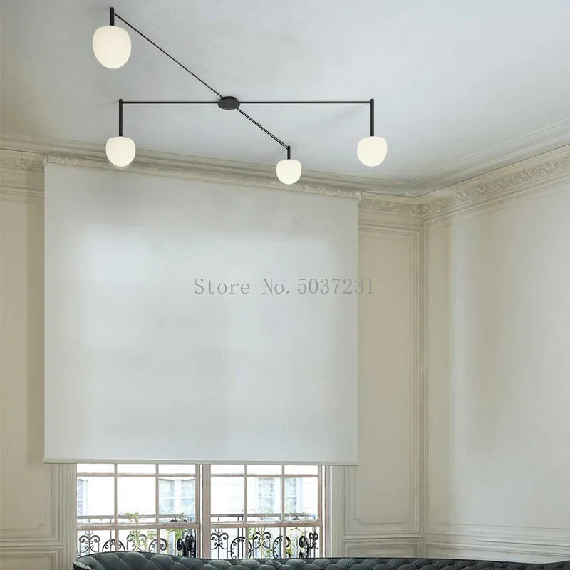 Plafonnier LED suspendu de style nordique moderne et minimaliste.