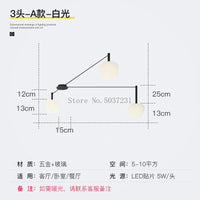 Plafonnier LED suspendu de style nordique moderne et minimaliste.