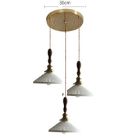 Suspension  design en céramique associant prise en cuivre et bois