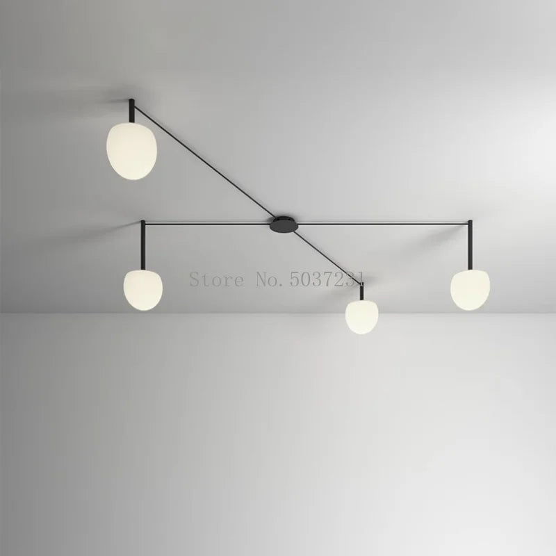 Plafonnier LED suspendu de style nordique moderne et minimaliste.