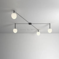 Plafonnier LED suspendu de style nordique moderne et minimaliste.