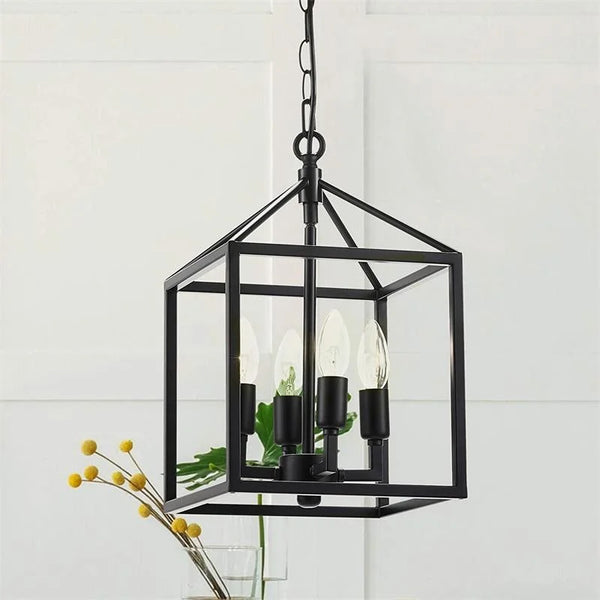 Lustre en fer avec cage à oiseaux et lumières suspendues.