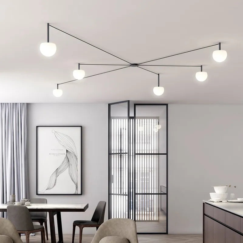 Plafonnier LED suspendu de style nordique moderne et minimaliste.