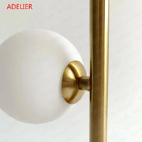 Lampe de table NordLume en boule de verre, design nordique, en fer ou en or