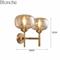 Applique murale design LED dorée avec abat-jour en verre - Sconce Glam | Marco Lucetti 2 lampes / Verre ambré