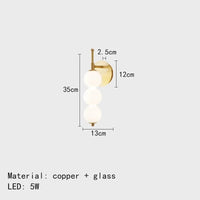 Applique murale design "Lumière Élégante" en boules de verre blanc | Marco Lucetti 3 boules-or