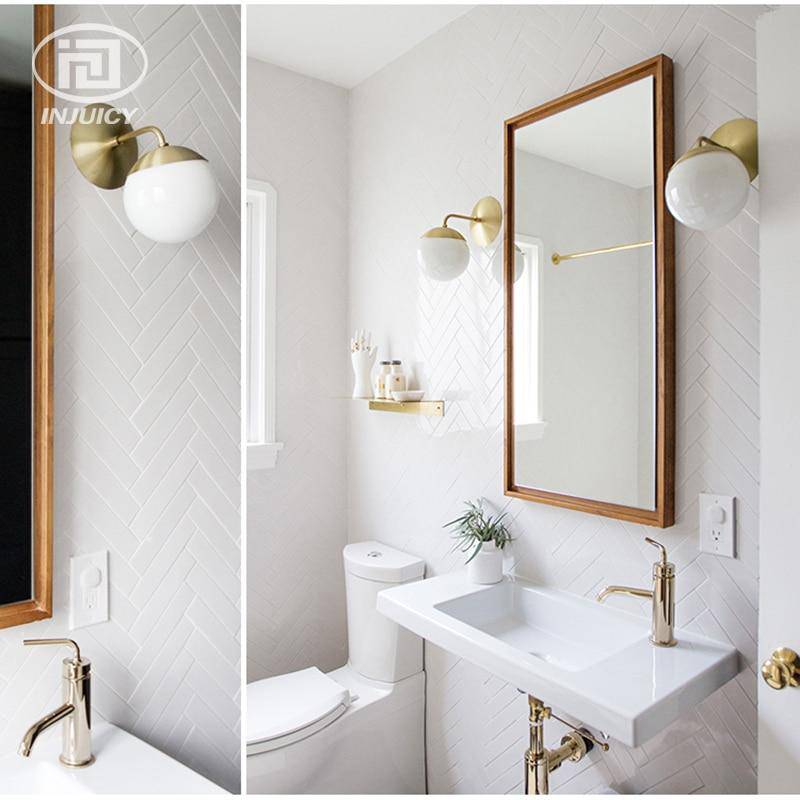 Applique murale dorée Bean, bras en verre à boule | Marco Lucetti