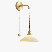 Applique murale dorée céramique moderne ajustable LED. | Marco Lucetti