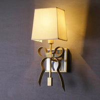 Applique murale en laiton en forme de nœud pour une touche de rêverie dans la chambre d'enfant | Marco Lucetti