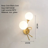 Applique murale LED élégante avec boule de verre pour intérieur. | Marco Lucetti