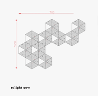 Applique murale LED "Honeycomb Glow" en acier inoxydable doré, pour une ambiance lumineuse postmoderne. | Marco Lucetti