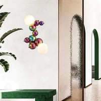Applique murale postmoderne boule de verre haricot magique en acier de luxe | Marco Lucetti