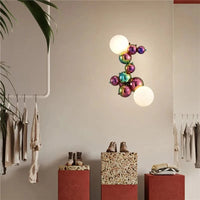 Applique murale postmoderne boule de verre haricot magique en acier de luxe | Marco Lucetti