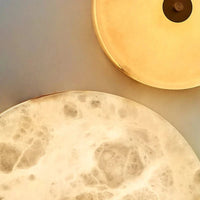 Applique murale ronde en marbre LED pour un éclairage chaleureux et moderne | Marco Lucetti