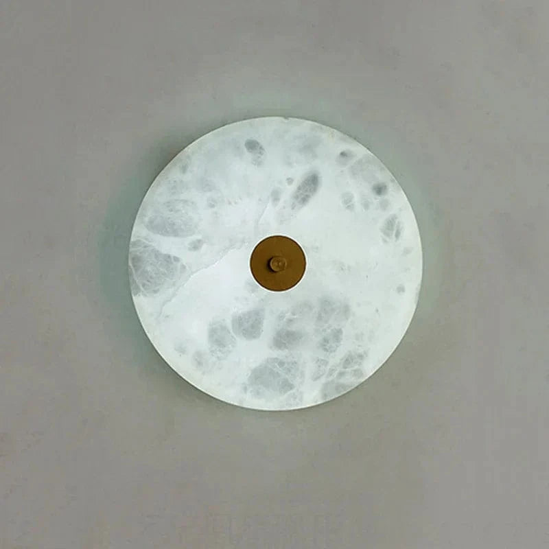 Applique murale ronde en marbre LED pour un éclairage chaleureux et moderne | Marco Lucetti