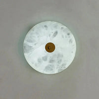 Applique murale ronde en marbre LED pour un éclairage chaleureux et moderne | Marco Lucetti