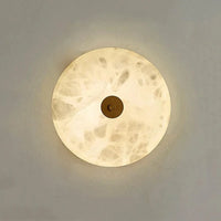 Applique murale ronde en marbre LED pour un éclairage chaleureux et moderne | Marco Lucetti