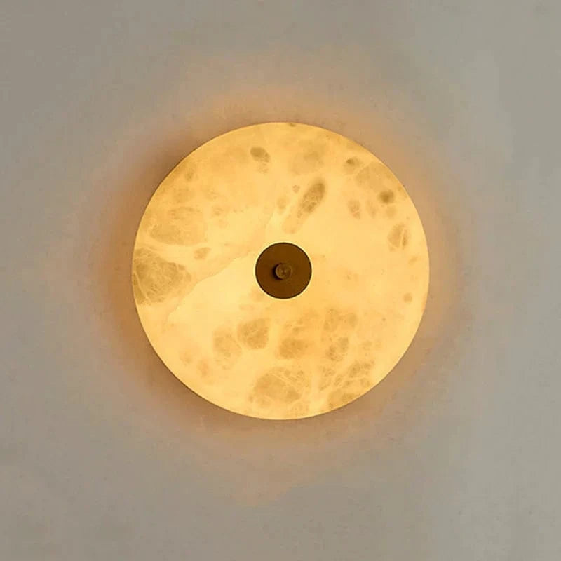 Applique murale ronde en marbre LED pour un éclairage chaleureux et moderne | Marco Lucetti
