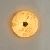 Applique murale ronde en marbre LED pour un éclairage chaleureux et moderne | Marco Lucetti