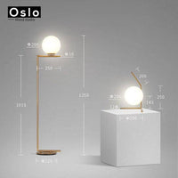 Lampadaire design doré LED avec boule de verre | Marco Lucetti Lampadaire