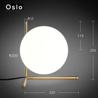 Lampadaire design doré LED avec boule de verre | Marco Lucetti Lampadaire