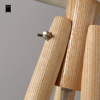 Lampadaire trépied scandinave en bois | Marco Lucetti