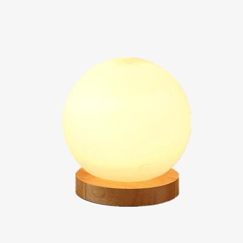 Lampe à poser LED design avec base en bois et boule en verre