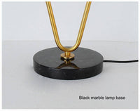 Lampe de chevet à deux branches dorées et boules en verre | Marco Lucetti