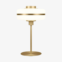 Lampe de chevet moderne LED à pied doré et forme arrondie. | Marco Lucetti