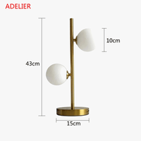 Lampe de table NordLume en boule de verre, design nordique, en fer ou en or