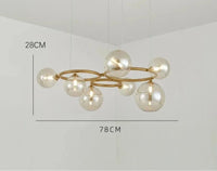 Lampe suspendue d'art en verre fumé de luxe | Marco Lucetti Lampe à 7 verres / Corps de lampe doré / Verre clair | lumière blanche