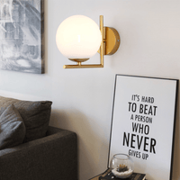 Luminaire contemporain avec boule en verre noir ou doré | Marco Lucetti