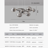 Lustre de verre et métal en boule et barre design | Marco Lucetti