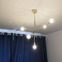 Lustre doré - Créativité en design | Marco Lucetti