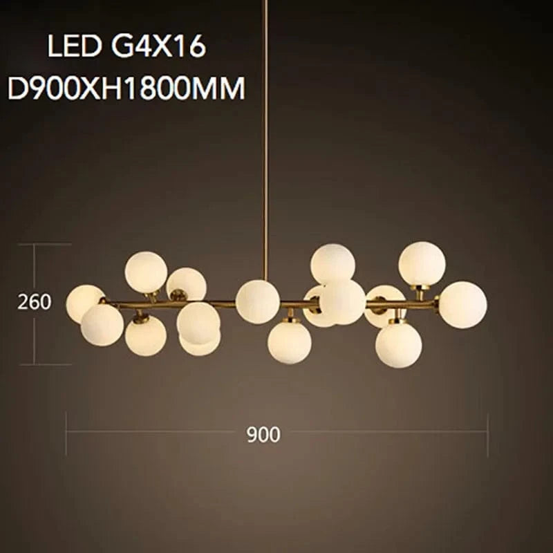 Lustre doré de luxe avec boule en verre et corps doré innovant | Marco Lucetti