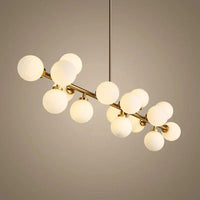 Lustre doré de luxe avec boule en verre et corps doré innovant | Marco Lucetti