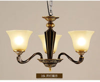 Lustre en cuivre forgé : Éclairage de luxe vintage aux bougies rustiques. | Marco Lucetti