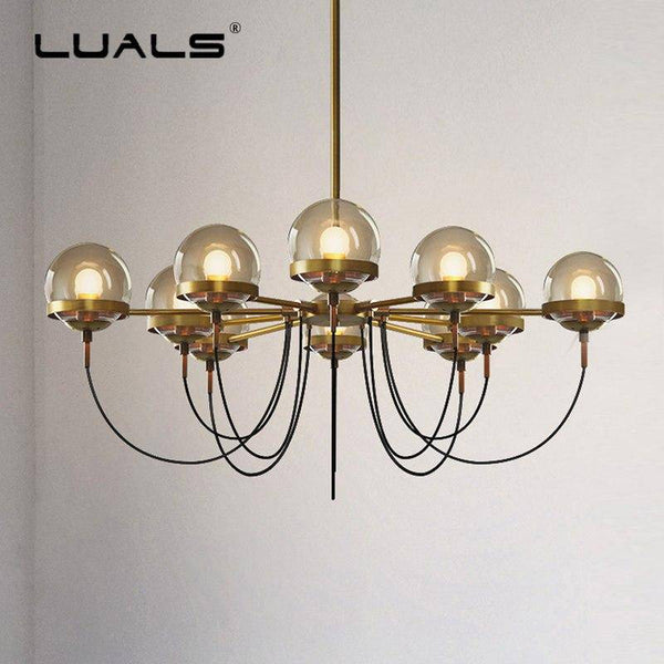 Lustre industriel doré avec boule en verre | Marco Lucetti