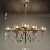 Lustre industriel doré avec boule en verre | Marco Lucetti 8 lampes