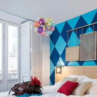 Lustre LED en boule de verre pour une suspension lumineuse et élégante. | Marco Lucetti